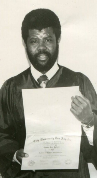 Graduate holding a Bachelor of Business Administration diploma