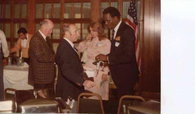 Guests greeting one another at a university reception