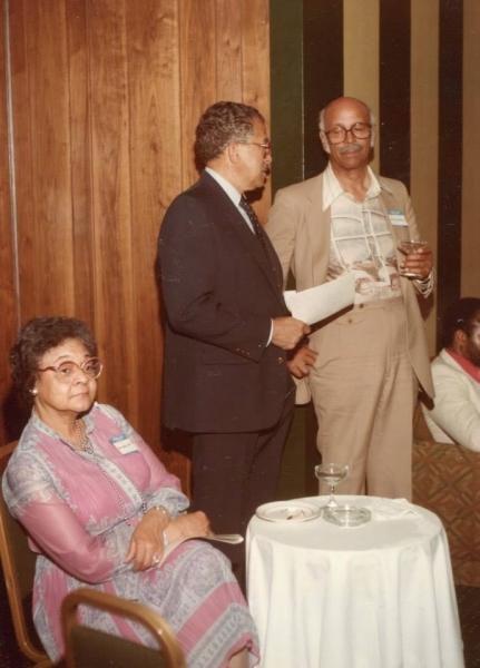 University supporters in conversation at an evening reception