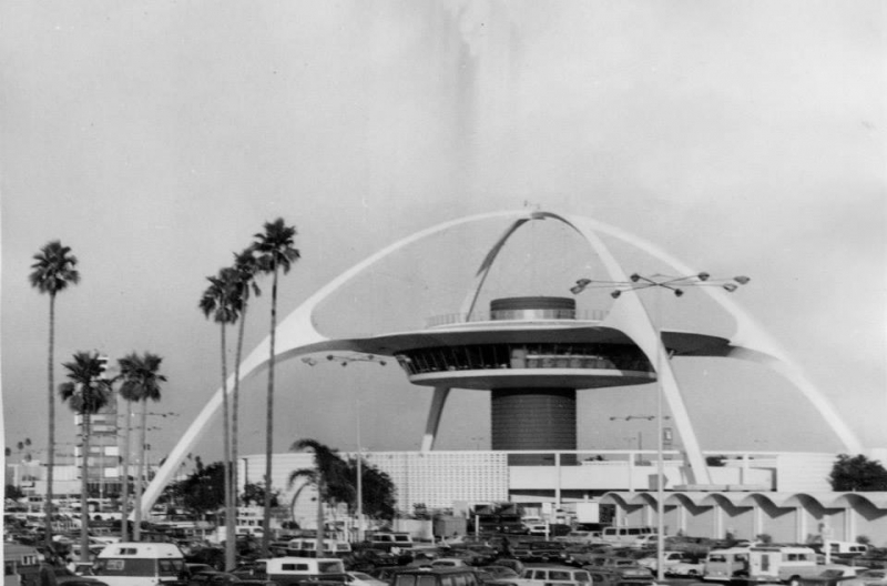 Archival photograph of a mid-century Los Angeles landmark with palm trees